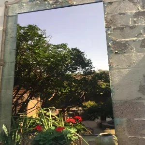 304 grade mirror stainless steel sheet reflecting brick wall and window